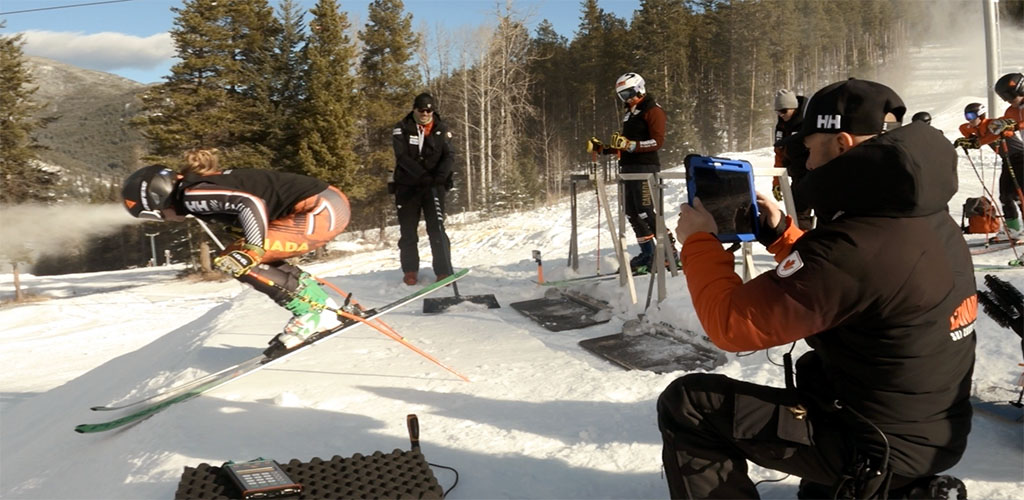 Ski Cross coach filming athlete with an iPad